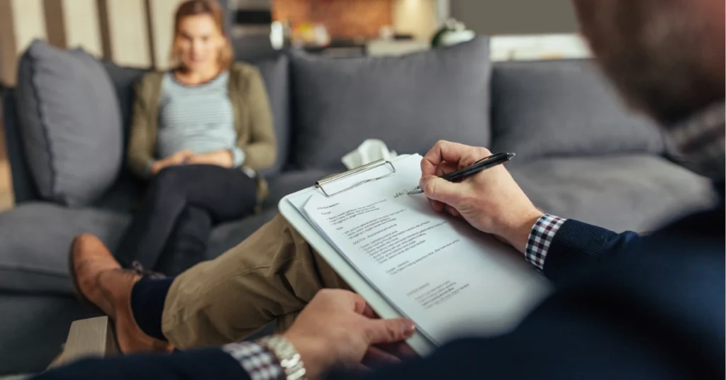 Therapist providing behavioral health services during counseling session offering professional mental health support