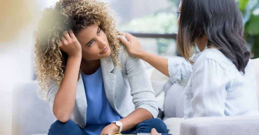 Two women having meaningful conversation about awareness and personal growth as the beginning of transformative change